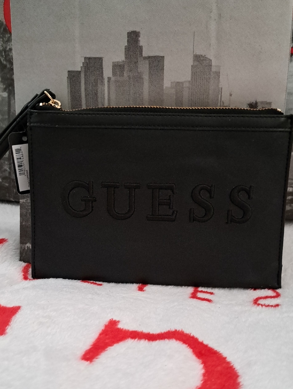 GUESS Black Embossed Logo Zip Wristlet with Gold Hardware